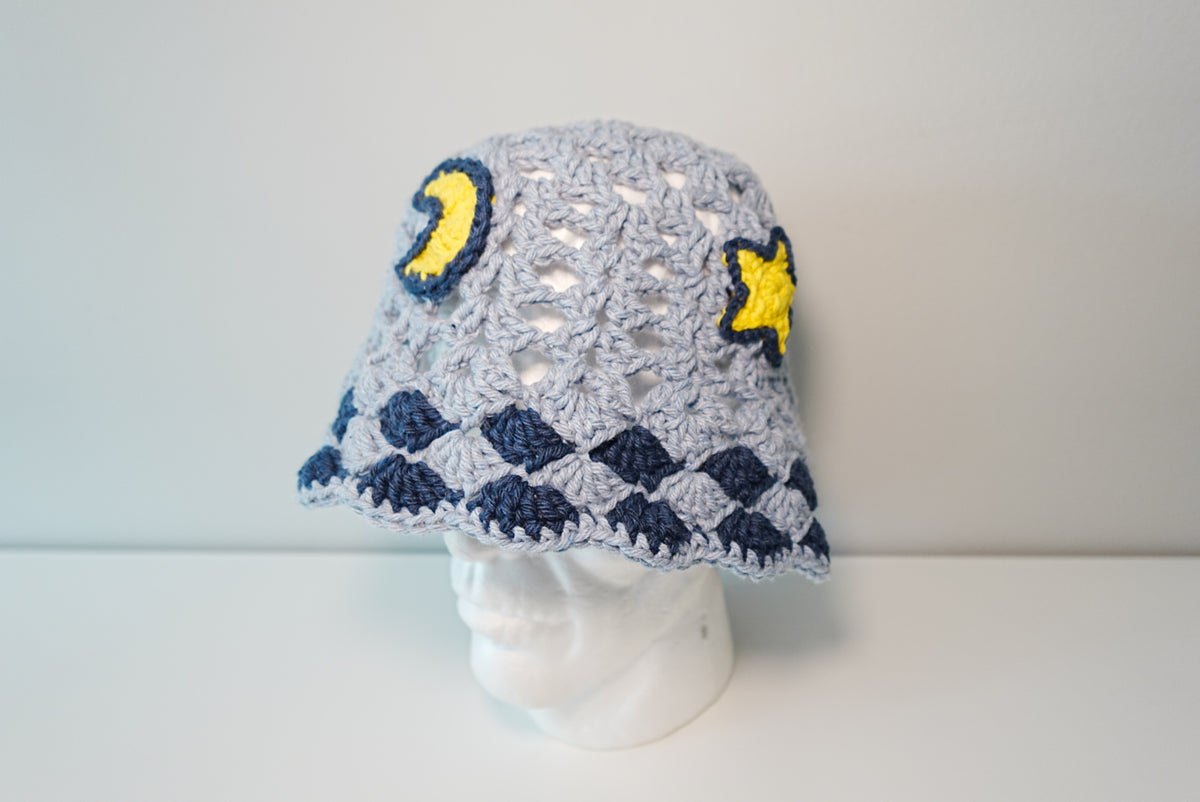 A Moon and Stars Crochet Hat in Denim Blue color
