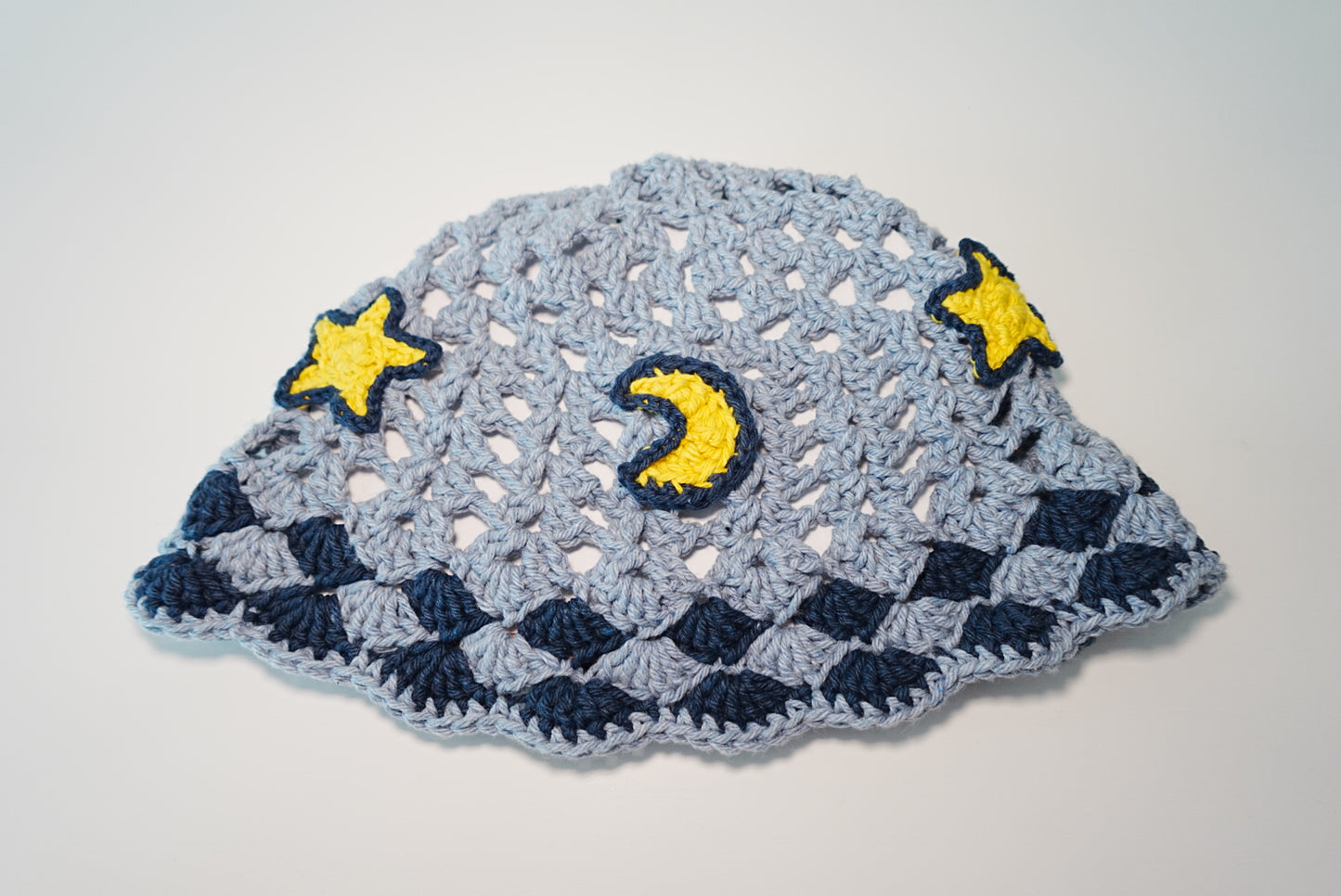 A Moon and Stars Crochet Hat in Denim Blue color